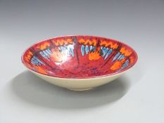 Poole pottery pedestal dish with orange and blue decoration on a red ground, H9, Diameter 34cm
