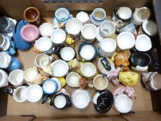 Approximately 40 novelty egg cups including retro, kitsch, Wade Walt Disney, Pink Panther and Sesame