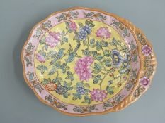 A 20thC Chinese enamelled pedestal dish decorated with chrysanthemums and birds, with four character