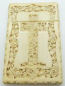 A 19thC Chinese carved ivory card case depicting court scenes inside a cross to each side and a