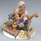 Capodimonte figure of an arab trader seated on a carpet, with certificate, H26cm