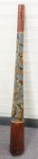 An indigenous peoples of Australia didgeridoo with painted decoration depicting a lizard and