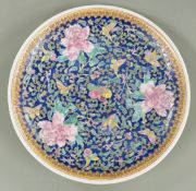 Early 20thC Chinese charger with deep blue ground and floral decoration, with four character mark to