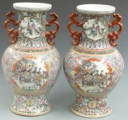 A pair of Chinese twin handled famille rose vases decorated with court scenes and bats, six