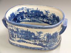 A large twin handled blue and white foot bath/jardiniere, H21, L46cm