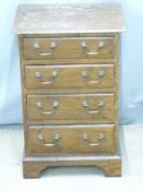 Chest of four drawers with brass handles, raised on bracket legs, W43 x H34 x D64cm