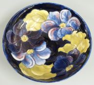 Moorcroft pedestal bowl decorated in the Clematis pattern on a blue ground, impressed marks and