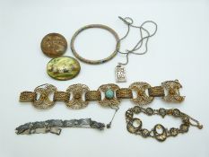A carved Chinese brooch, cloisonné bangle, Indian brooch, Japanese bracelet, Chinese silver pendant,