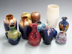 A collection of studio pottery vases in a range of glazes including flambé, lustre, star, crackle