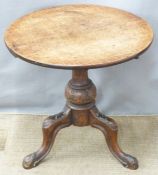 A circular oak table with carved legs, diameter 48 x H48cm