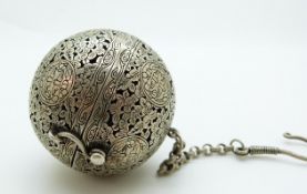 An Islamic incense burner with pierced decoration