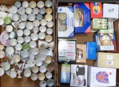 Approximately 65 novelty egg cups including many boxed examples including Lurpak, Harry James,