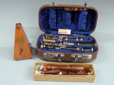 A cased Lark clarinet, together with a Dolmetsch treble recorder and a French-made metronome