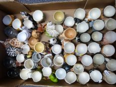Approximately 50 novelty egg cups, most animal / bird themed
