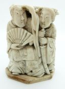 Japanese Meiji period or earlier okimono depicting a man and woman with pegged removal base, 6.5cm