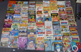 A large collection of comic books and magazines including Tick, Mad, Spider-Man, Private Eye, Roy Of
