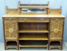 Arts and Crafts carved oak sideboard with galleried mirror back, adjustable shelving, panelled doors