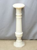 An alabaster jardinière stand in the form of an architectural column, diam 25cm H94cm
