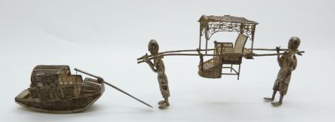 A Chinese white metal filigree boat and Chinese white metal filigree Sudan chair, both marked