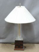 A cut glass table lamp raised on a chinoiserie decorated plinth and another alabaster lamp with swan