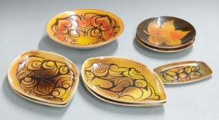 Eight Poole pottery Aegean pattern dishes including four spear dishes, largest diameter 30cm