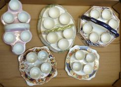 Five ceramic egg cruets including Imari and relief moulded examples, tallest 13cm