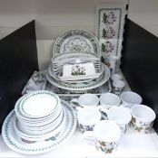 A collection of Portmeirion Botanic Garden dinner and tableware including butter dish, clock and