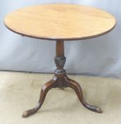 A 19thC mahogany tilt top table raised on a turned support and tripod base, the top a single piece