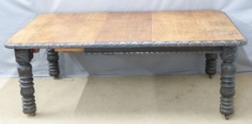 19thC oak wind-out extending dining table with carved edge and legs and two extra leaves, maximum