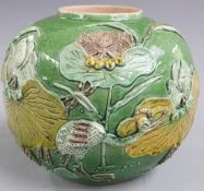 A late 19thC Chinese green glaze ginger jar with crane and floral decoration in relief by Wang