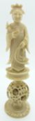 A 19thC carved Chinese ivory chess piece with puzzle ball, 13.5cm