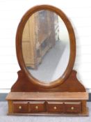 An oval mahogany dressing table mirror with four drawers W88 x D20 x H110cm