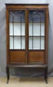 An inlaid glazed mahogany display cabinet raised on cabriole legs, W90 x D32 x H67cm
