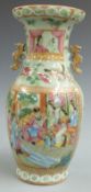 A 19th/ 20thC Chinese famille rose vase with figural scene and gilt twin handles, 23cm tall