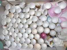 Approximately 70 novelty egg cups including nursery ware, Beatrix Potter, souvenir ware etc