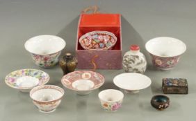 A collection of Chinese ceramics comprising two 19thC Chinese teabowls on bases each with four