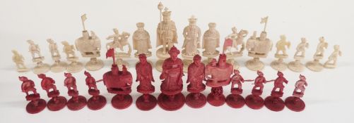 A 19thC/early 20thC Chinese carved ivory part chess set, one side stained red, height of king