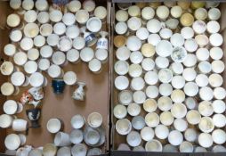 Approximately 140 novelty egg cups including Coalport, Wedgwood, Royal Doulton, Adderley, Imari,