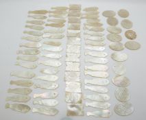 Approximately 74 19thC Chinese mother-of-pearl gaming counters including 47 fish, eight oval, six