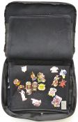 A collection of Hard Rock Café pin badges in a branded carry case
