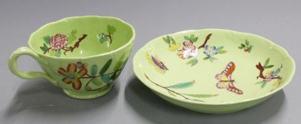 19thC/20thC cabinet cup and saucer, hand decorated with butterflies and flora in enamels, H6.5cm