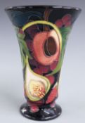 Moorcroft pedestal flared vase decorated with peaches, figs and grapes, dated 2000, H15cm