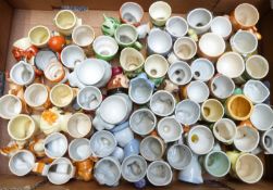 Approximately 60 novelty egg cups, mostly Japanese / foreign, kitsch and retro examples