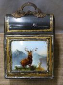 A metal coal scuttle with hinged crystoleum lid and stag decoration, H 44cm