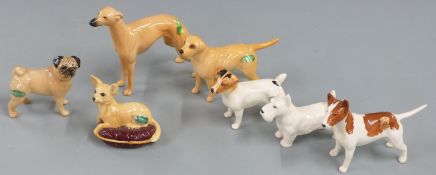 Seven Beswick dog figures including English bull terrier, whippet, chihuahua, Jack Russell etc,