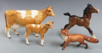 Beswick Guernsey cow and calf together with a fox and a foal