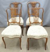 Four Edwardian inlaid rosewood salon chairs raised on fine cabriole legs and three others