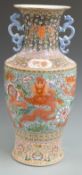 A large Chinese twin handled famille rose vase decorated with dragons, with six character mark to