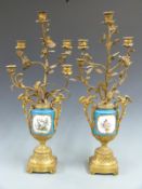 A pair of Sevres style vases in ormolu candelabra mounts, H70cm