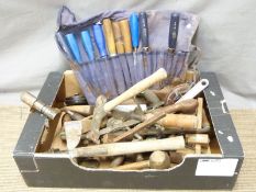 A collection of woodworking tools including planes, chisels, folding rulers etc